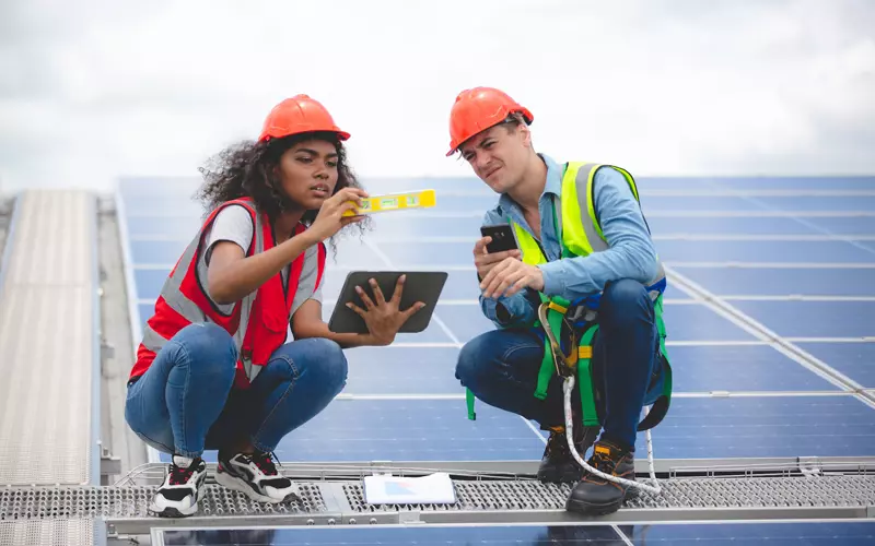 specialist-technician-professional-engineer-checking-top-view-of-installing-factory-solar-roof-panel.webp